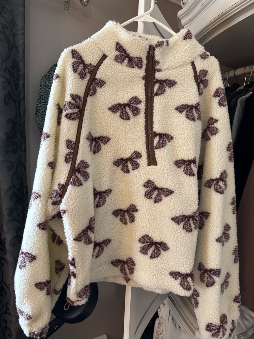 Cream Sherpa Turtleneck Pullover with Brown Bow Print